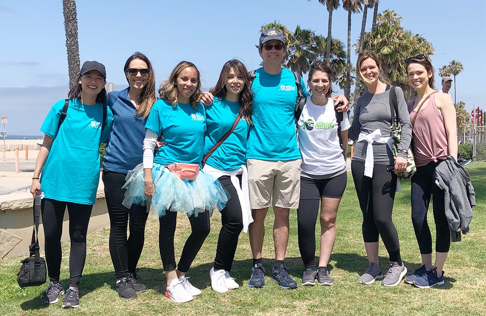 Dr. Jay Granzow, MD, stands with a group of people at the annual run/walk to fight lymphedema and lymphatic diseases.